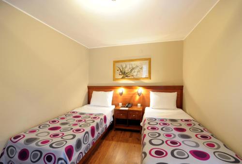 Hotel 1000 Ruzaにあるベッド