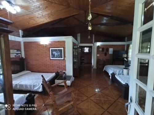a room with two beds and a couch in it at Villa Monica in Montenegro