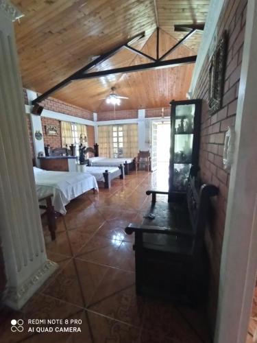 a large room with two beds and a table at Villa Monica in Montenegro