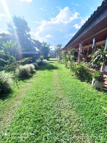 a field of grass next to a building at Villa Monica in Montenegro