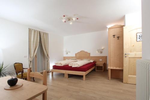 Ένα ή περισσότερα κρεβάτια σε δωμάτιο στο Agritur al Canyon
