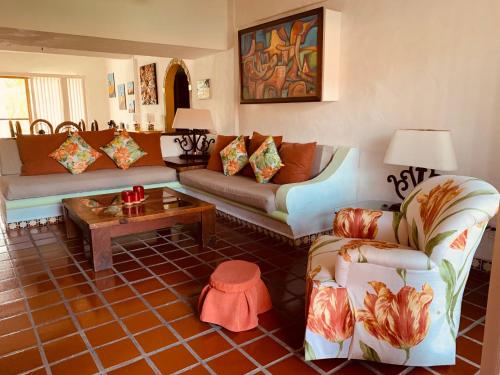 a living room with two couches and a coffee table at Departamento en Marina Vallarta New listing in Puerto Vallarta