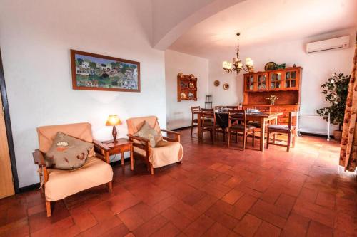 a living room with a table and chairs at Villa 300m from Beach - By Algarkasa in Albufeira