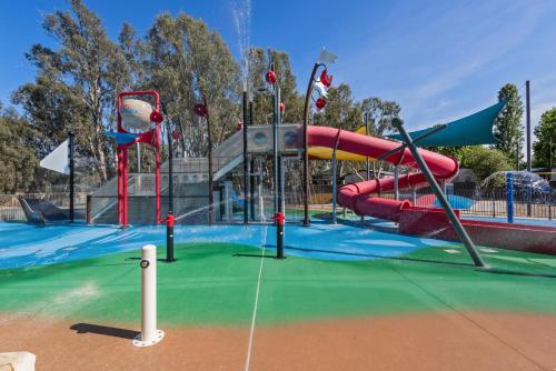a playground with a water slide in a park at Discovery Parks - Maidens Inn Moama in Moama