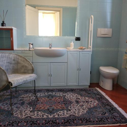 a bathroom with a sink and a toilet at B&B Palazzo Mestichelli Boutique Palace in Monteprandone