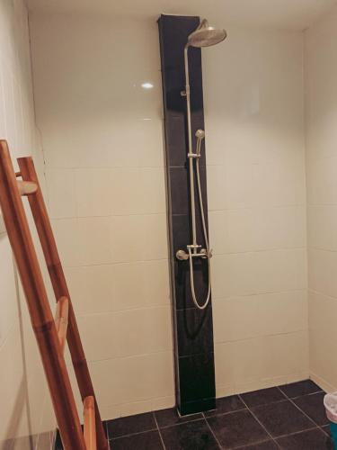 a shower with a glass door in a bathroom at High Life Bungalow in Haad Yao