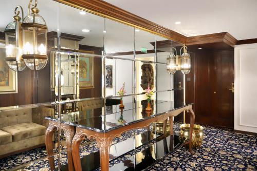 a lobby with a glass table and a couch at The Ambassador, Marine Drive, Mumbai in Mumbai