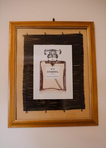a picture of a picture frame with a picture of a sewing machine at Apollo Stay in Apollo Bay