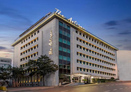 a building with a sign on the side of it at The Artisan Hotel Istanbul - MGallery Collection in Istanbul