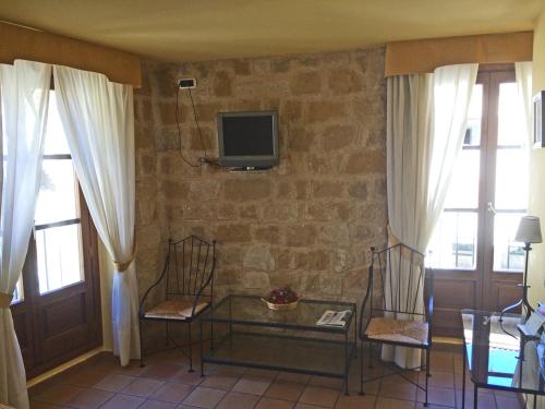 TV a/nebo společenská místnost v ubytování HOTEL GUADALOPE