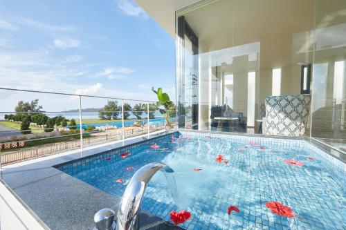 a swimming pool in the middle of a house at RIZOZAIZEN MOTOBU B in Motobu