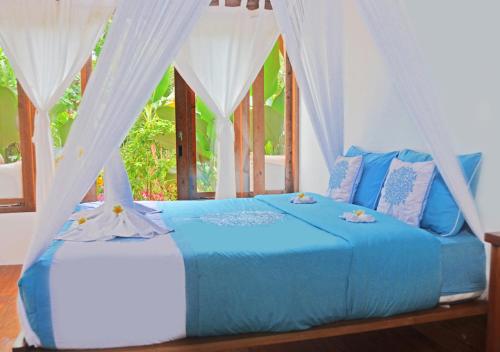 Кровать или кровати в номере Lagoona Beach Bungalows - Eco Stay