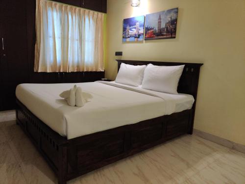 Ένα ή περισσότερα κρεβάτια σε δωμάτιο στο Coral Shelters Mattuthavani