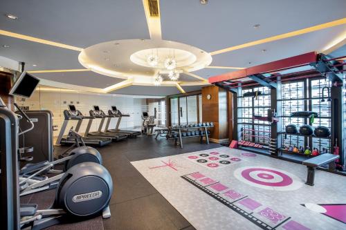 a gym with treadmills and exercise equipment in a building at Crowne Plaza Shanghai Fudan by IHG in Shanghai