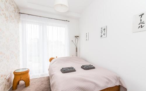 Postel nebo postele na pokoji v ubytování Vinorell Apartman