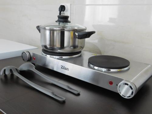 a mixer and utensils sitting on top of a counter at Apartments Mateo in Zagreb