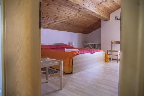 Кровать или кровати в номере Apartments Ospitalità Diffusa Borgate tra le Malghe