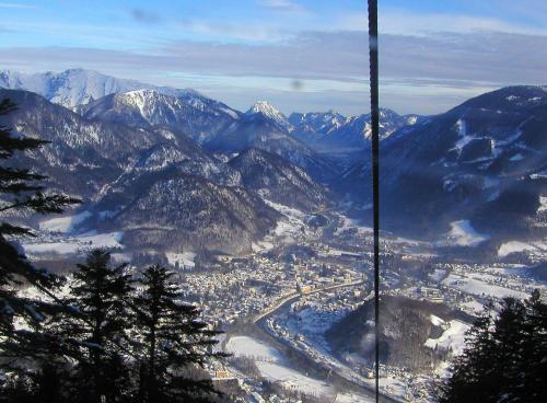 a view of a snowy mountain range with a city at Hotel Goldener Ochs in Bad Ischl