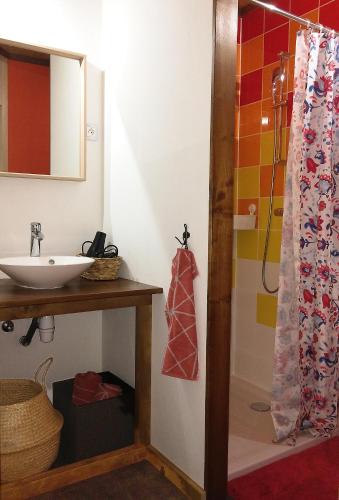a bathroom with a sink and a shower at Les Billardes - le gite - Jura in Gizia