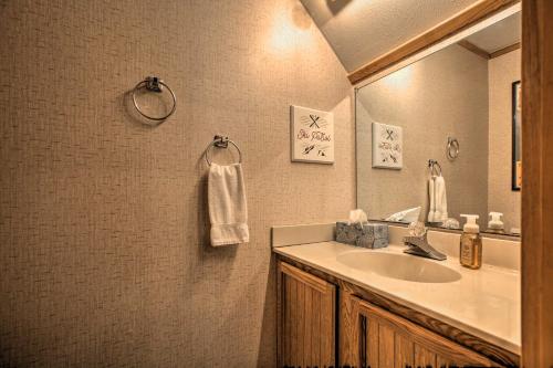 a bathroom with a sink and a mirror at Slopeside Snowshoe Condo - Walk to Ski Lifts! in Dunmore