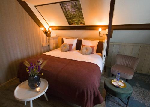Cama o camas de una habitación en Bed & Breakfast De Stippelberg