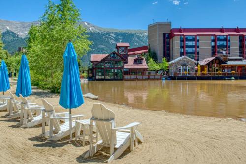 a group of chairs and umbrellas on a beach at Peregrine in Copper Mountain
