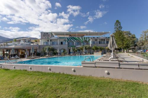 a large swimming pool in front of a building at Georgioupolis Beach Hotel in Georgioupolis