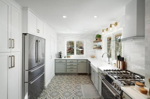 a kitchen with white cabinets and a stainless steel refrigerator at Lemond Place Home in Snowmass Village