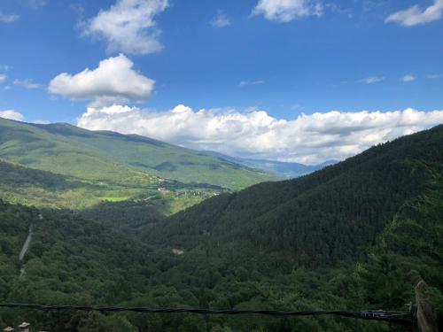 a view of a green valley with mountains at Casa Rural Pirineu Nevà in Nevà