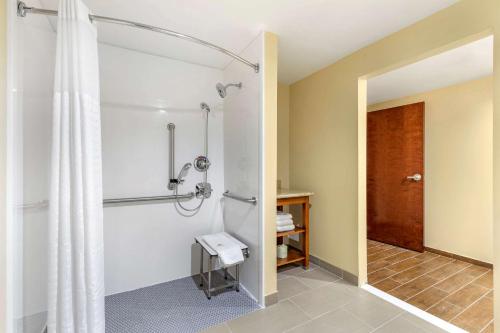 a bathroom with a shower with a shower curtain at Comfort Suites San Antonio Ft Sam Houston-SAMMC Area in San Antonio