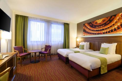 Postel nebo postele na pokoji v ubytování Hotel Opera Antwerpen Centrum