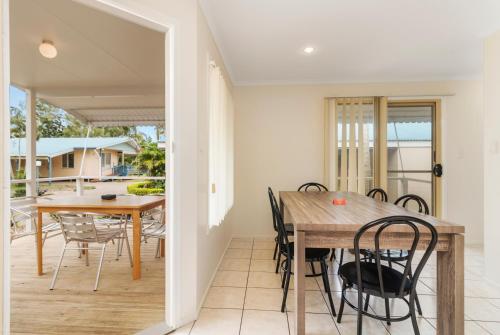 a dining room with a table and chairs at Discovery Parks - Coolwaters, Yeppoon in Kinka