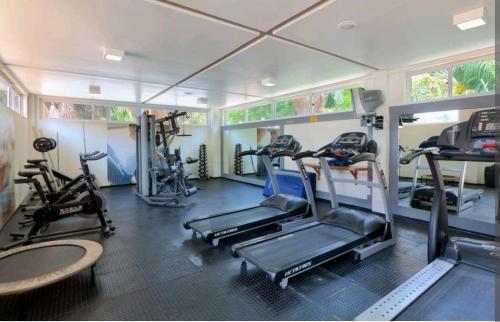 a gym with several tread machines in a room at Gran Lençóis Flat Residence Barreirinhas - Mandacaru 211 in Barreirinhas