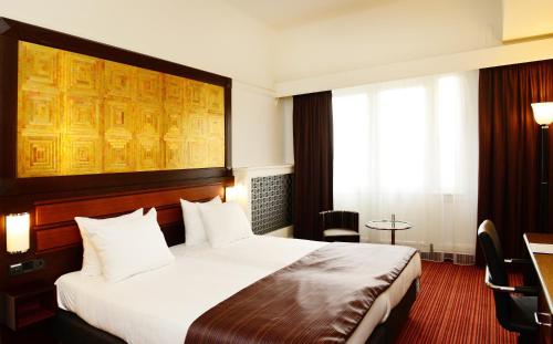 Posteľ alebo postele v izbe v ubytovaní Amrâth Hotel DuCasque