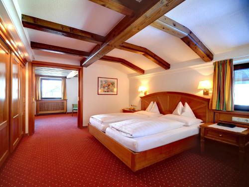 Ένα ή περισσότερα κρεβάτια σε δωμάτιο στο Heart Hotel Arlberg