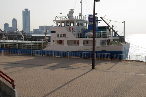 a boat is docked at a dock in the water at GUEST HOUSE APPLE in Osaka