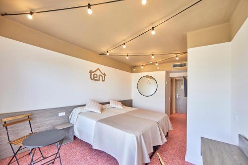 a hotel room with a bed and a table and chairs at tent Playa de Palma in Playa de Palma