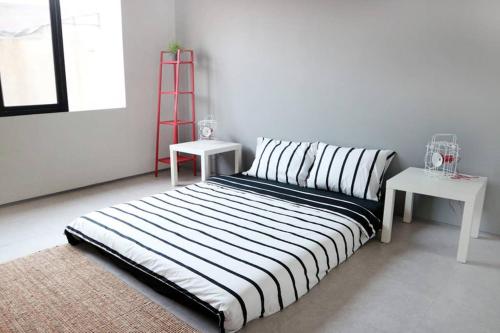 Postel nebo postele na pokoji v ubytování Minima Residence