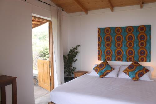 Postel nebo postele na pokoji v ubytování La Fora Ecolodge