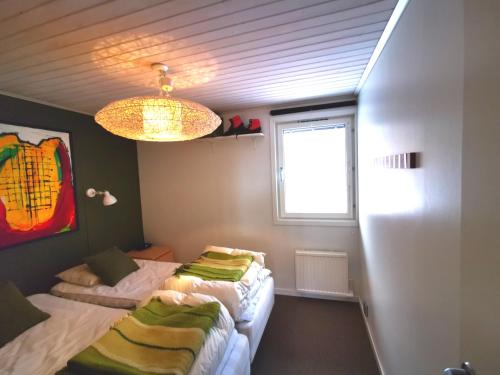 Krevet ili kreveti u jedinici u okviru objekta Stayin Borgafjäll - Tuffa Lillan - Bo bakom hotellet