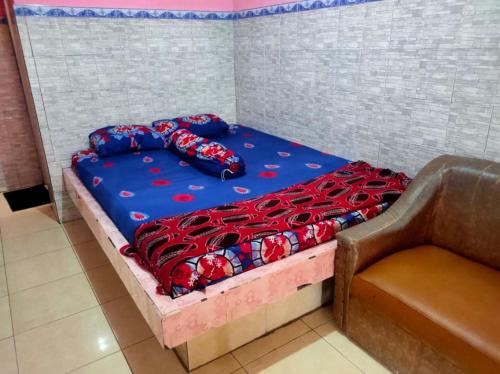 Postel nebo postele na pokoji v ubytování Hotel Abimanyu Bandungan