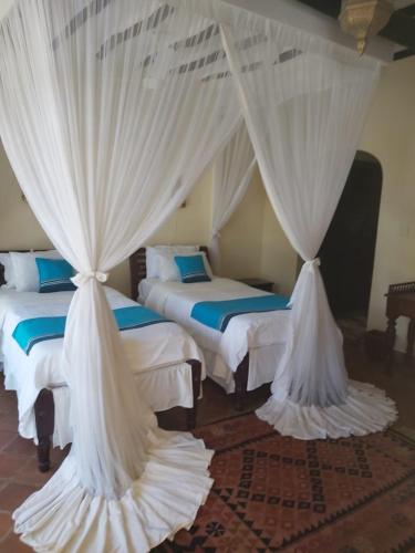 Un ou plusieurs lits dans un hébergement de l'établissement Asha Boutique Hotel
