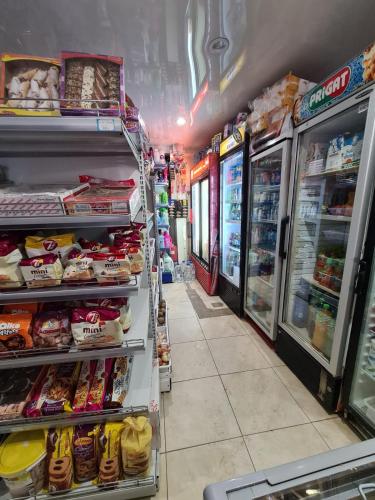 a store aisle of a grocery store with food at VILA VALENCIA in Azuga