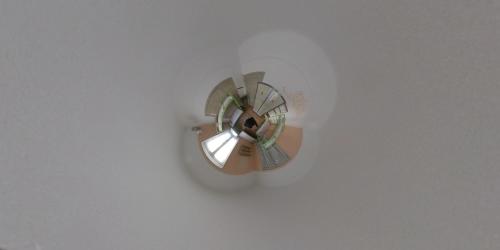 a fan is hanging on a white wall at Pagration Youth Hostel in Athens