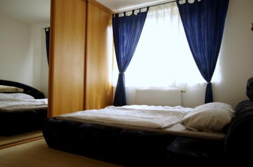 a bed sitting in a bedroom with a window at apartment golden Prague in Prague