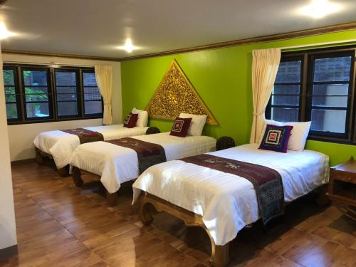 Krevet ili kreveti u jedinici u okviru objekta Hotel Siblanburi Resort