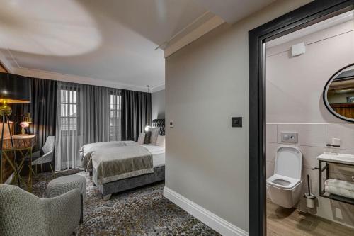 Кровать или кровати в номере HOTEL BOUTIQUE DONNA ANNA