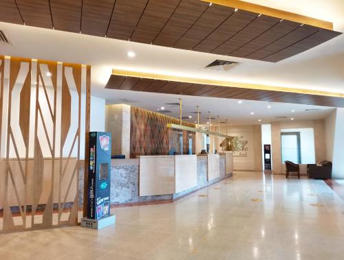 a lobby of a building with a reception desk at Royal Solaris Cancun-All Inclusive in Cancún