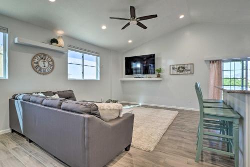 a living room with a couch and a ceiling fan at Hurricane Getaway with Yard - 25 Mi to Zion! in Hurricane