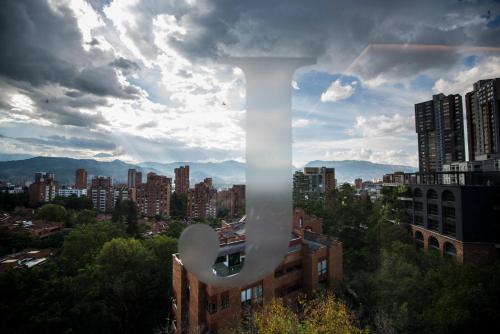 a large white object in the sky over a city at Lettera Hotel in Medellín